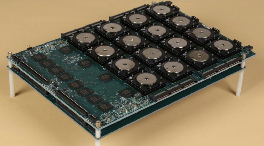 A circuit board with a 4×4 array of SyNAPSE-developed chips. Each chip has one million electronic “neurons” and 256 million electronic synapses between neurons. Built on 28nm process technology, the 5.4 billion transistor chip has one of the highest transistor counts of any chip ever produced as of 2014.