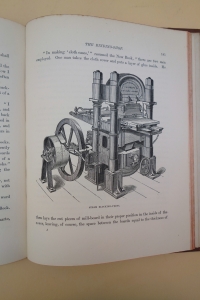 An elaborate steam-powered blocking press used in bookbinding.