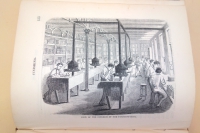 The small furnaces attached to each bindery bench heated the tools used to hand-stamp designs into leather bindings. They were connected to a central exhaust pipe.